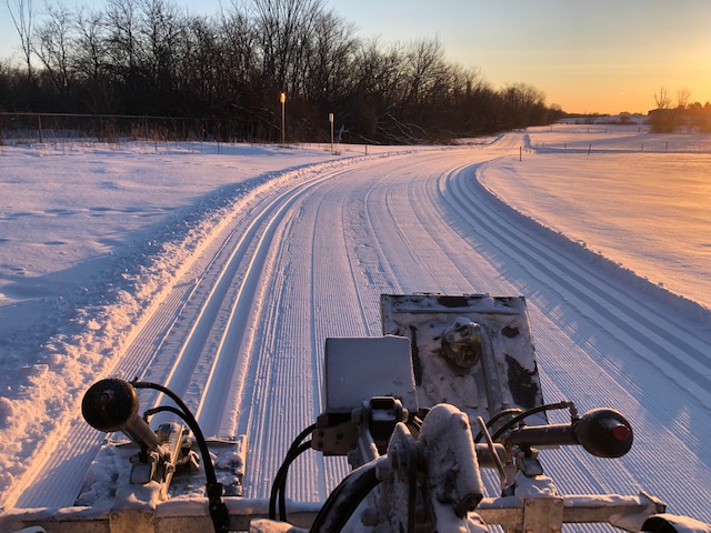 Groomer and set track at Kanata Nordic at sunrise